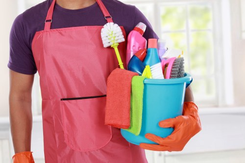Professional carpet cleaner in Harringay deep cleaning a living room carpet