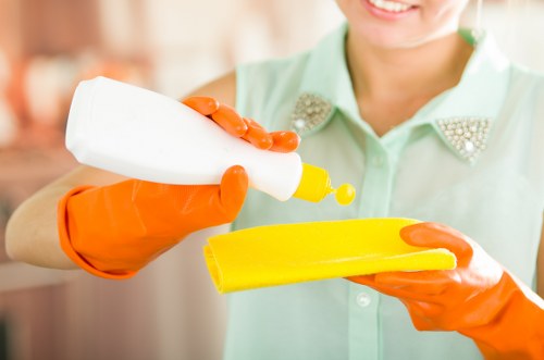 Staff following a health and safety policy during carpet cleaning